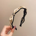 Elegant camellia headband featuring beige and black fabric with golden roses and crystals - Champagne