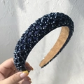 Close-up of a dark blue velvet headband with delicate faux pearl beads detail - Navy Blue