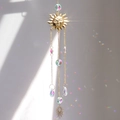 Golden sun face suncatcher with multifaceted crystal drops and hanging metal chains - A18