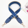 Close-up of blue and beige canvas strap with golden metal buckles and leather ends - Lake Blue & Lake Blue