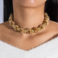 Collier ras du cou de Noël avec pompons en fausse fourrure léopard et perles dorées - Léopard Marron