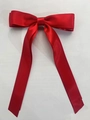 Detail of red satin double bow hair clip with long flowing ribbon streamers - Red