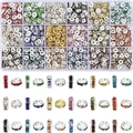 Macro view of 15 colors of crystal rhinestone spacer beads in a clear plastic storage box - 18 Grids 1170 Pcs