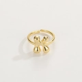 Detailed view of the 18K gold letter K ring with a polished open adjustable band - Gold Ring K