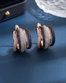 Rose gold tiered hoop earrings with purple and white pavé zircon stones on blue background - Tri-Color Rose Gold