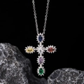 Silver cross necklace with multicolor zircon gemstones on a dark stone background - Silver Colorful Gem Cross (Style 12)