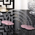 Rainbow acrylic earring display stand with a pink cloud base on a mirrored surface - Transparent