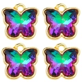Close-up of four colorful crystal butterfly pendants with gold metal frames and hanging loops - Rainbow Gradient