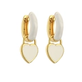 Detail of gold heart earrings with white enamel finish and polished metal hoop - White