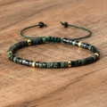 Adjustable woven bracelet with dark green emperor stone beads and golden spacers - No.40 Picasso Stone