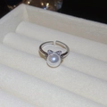 Macro detail of silver adjustable cat-ear ring with a white pearl in a jewelry box - Cat Ear Bow Pearl Ring (1#)