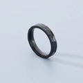 Macro detail of black hammer textured stainless steel ring with industrial faceted design - Black (4mm)