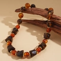 Detail of amber acrylic beaded necklace with geometric resin pieces on wood - Style 4 - Coffee Brown (WN1674)