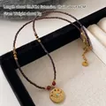 Ethnic beaded tiger eye necklace in deep red with evil eye charm and steel tag - Czech Crystal Necklace XL0756