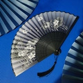 Traditional Chinese folding fan with blue gradient lotus print and black tassel detail - Blue Gradient Lotus Dragonfly