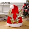 Red Christmas hat with golden reindeer antlers and bow on a festive wooden surface - Adult Velvet Large Antlers Hat Gold