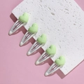 Close-up of five white metal BB clips with light green heart-shaped resin decorations - Green