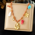 Collana boho in corda intrecciata con fiori di tulipano, ciondoli d'oro e perline - Stile Multielemento Tulipano e Ciliegia (N3800)