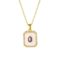 Macro detail of 18K gold plated pendant featuring a purple oval stone and clear zircons - Oval Purple Zirconia Necklace