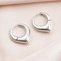 Polished silver heart shaped huggie earrings on premium peach silk fabric - Silver V-Shape Ear Buckle
