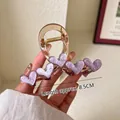 Eleganter champagnergoldener Haarclip mit fünf lila Marmorherzen, Länge ca. 8,5 cm - Lila Trauben-Prickelnd