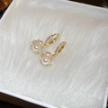 Detailed view of gold-plated pearl earrings with sparkling diamond-set hoops on white fur - Gold Pearl Ball Ear Hoop (23# Ear Clip)