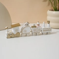 Detail of white and gold wooden Christmas train with miniature figures and gift boxes - Fan-shaped White Train / White