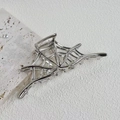 Detailed view of silver spider web hair claw clip with hollow metal design for Halloween - Alloy Metal / Silver Spider Web (10.5cm)