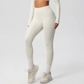 Detail showing high-waisted yoga pants and long sleeve top in soft off-white stretch fabric - 7100 Trousers - Light Ivory / S