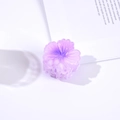 Detail view of a 4.5cm camellia flower hair claw clip in gradient purple color - Purple