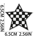 Detail view of 6.5cm star-shaped black and white checkered embroidered patch for bags - Black and White Plaid Star (Large)