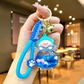 Porte-clés cochon bleu avec breloque à paillettes liquides et dragonne en silicone - Cochon Pêche Flocon de Neige Lumineux Bleu Klein