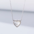 Macro shot of S925 silver heart necklace with white shell inlay and sparkling zirconia details - 925 Silver / Silver