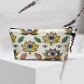 Detail of waterproof cosmetic bag with lotus eye pattern and black zipper on a display stand - White Lotus Eye