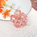Pink acetate flower hair claw clip with rhinestones and hollow petal design - Peach Pink
