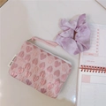 Detailed view of pink heart jacquard pouch with zip puller and decorative label - Pink Heart
