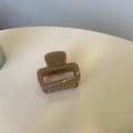 Detailed close-up of a square milk tea brown claw clip with a glossy resin finish - Deep Nude Pink