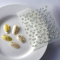 Detail of 3D embossed floral nail art stickers with white flowers and green leaves - White Flower and Green Leaf Relief Style (FEB-478)