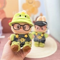 Plush doll accessory with green dinosaur hat and denim overalls featuring star embroidery - Green Dinosaur Hat + Frog Academic Outfit / First And Second Generation Keychains Are Compatible With La Cloth Dolls. Dolls Not Included.