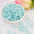 Blue and transparent frosted acrylic star beads in a small bowl for DIY jewelry making - Blue Transparent Star (83pcs)
