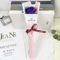Detail of single purple soap rose bouquet wrapped in blue and pink paper with ribbon - Purple Rose