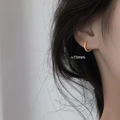 Minimalist 15mm gold geometric hoop earrings for women shown on ear for style - 15mm - Rose Gold Earrings