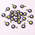 Macro shot of blue enamel flower charms with gold plating for DIY jewelry making - Sky Blue & Yellow