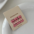 Close-up of three pink bone-shaped mini hair clips on an accessory display card - Deep Pink (Set of 3)
