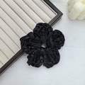 Elegant black woven flower scrunchie in satin fabric placed on white background - Flower / Black