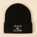 Classic black knitted beanie featuring white Leave Me Alone embroidery on a folded cuff - One Size / Black