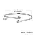 Detail view of silver teardrop open bangle with size dimensions 6.5cm diameter and 0.3cm width - Steel