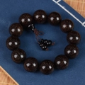 Macro shot of dark blood sandalwood beads with gold silk texture and traditional knot - Gourd Style (20200527) / 12 Pendants Set / Black Red Gold Star (20mm)