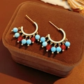 Macro detail of vintage gold C-shaped earrings with turquoise and red agate beaded pendants - Blue Red Agate C-Shaped Hoop Earrings (3# Silver Needle-Gold-Blue-Red-Gold Plated)