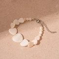 Elegant beaded heart bracelet with seashell luster and adjustable lobster clasp - White Mother Of Pearl Look Heart Beaded Bracelet